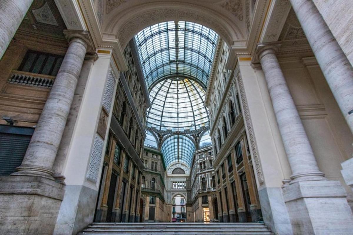 a large building with a glass ceiling and stairs