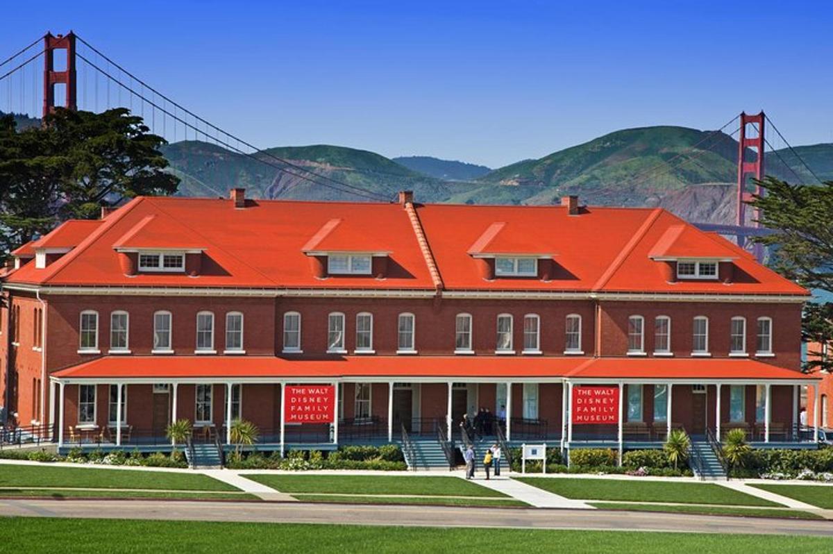 a large red building with the golden gate bridge in the background