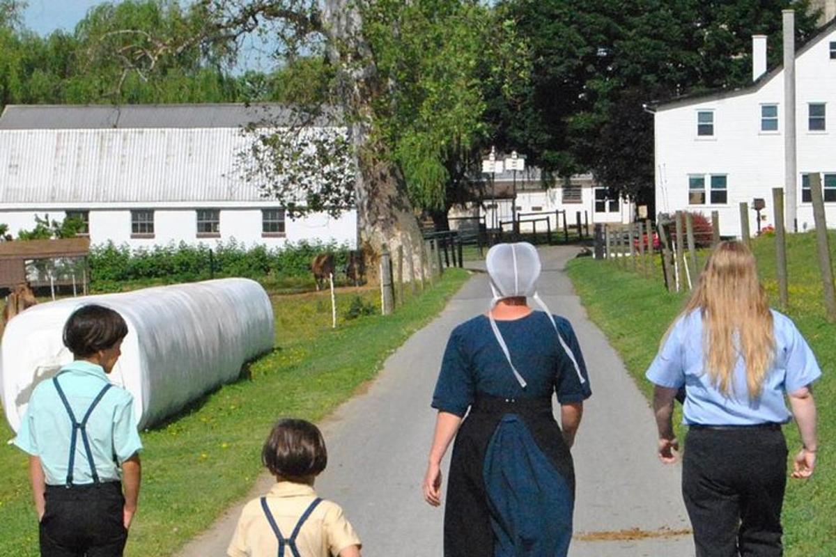 a group of people walking down a road