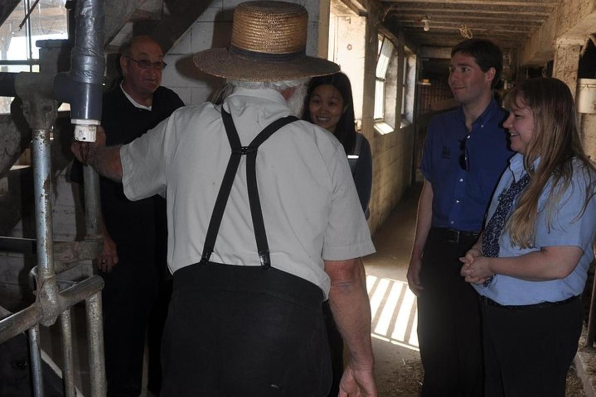 a man wearing a hat with a group of people