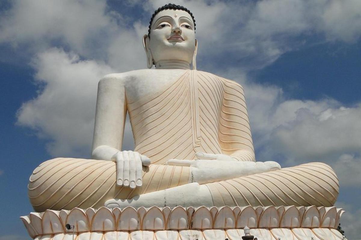 a large statue sitting on top of a building