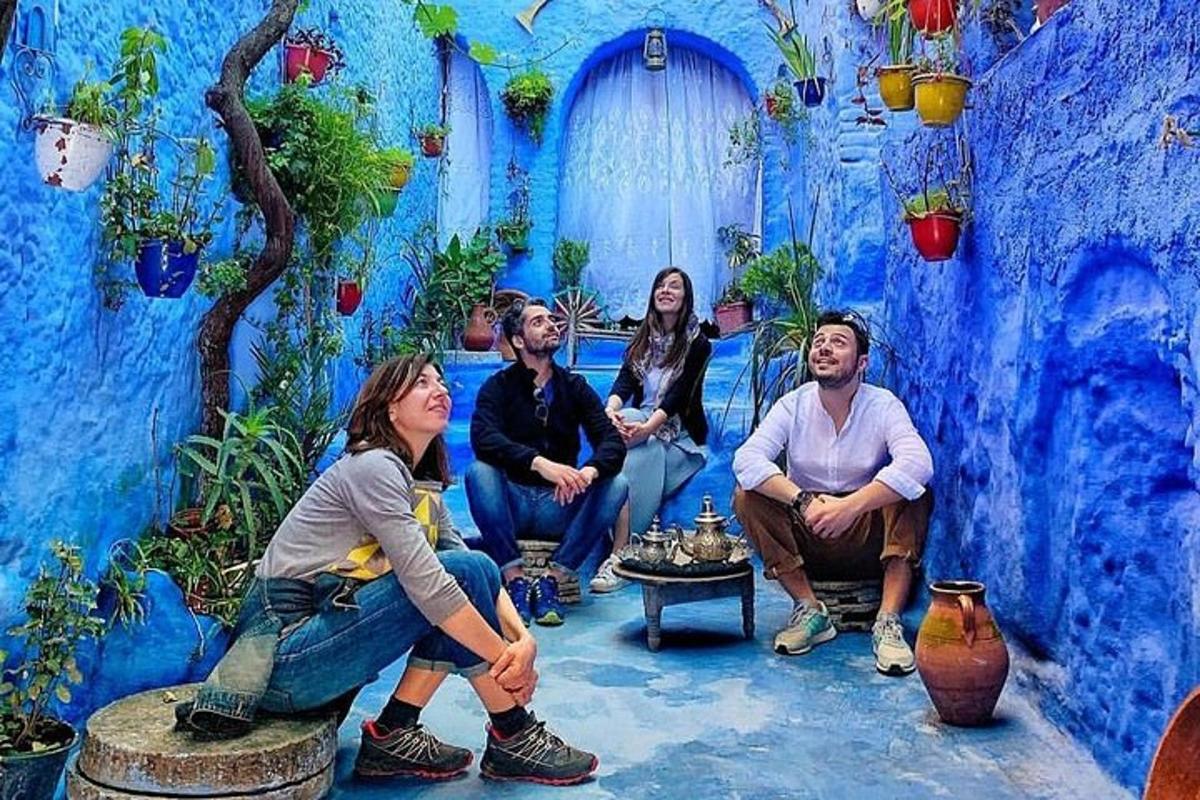 a group of people sitting in a blue room