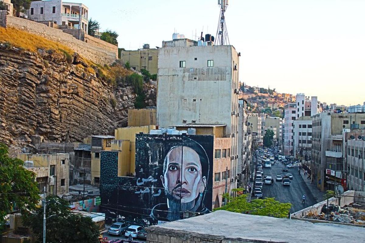 a large painting of a face on the side of a building