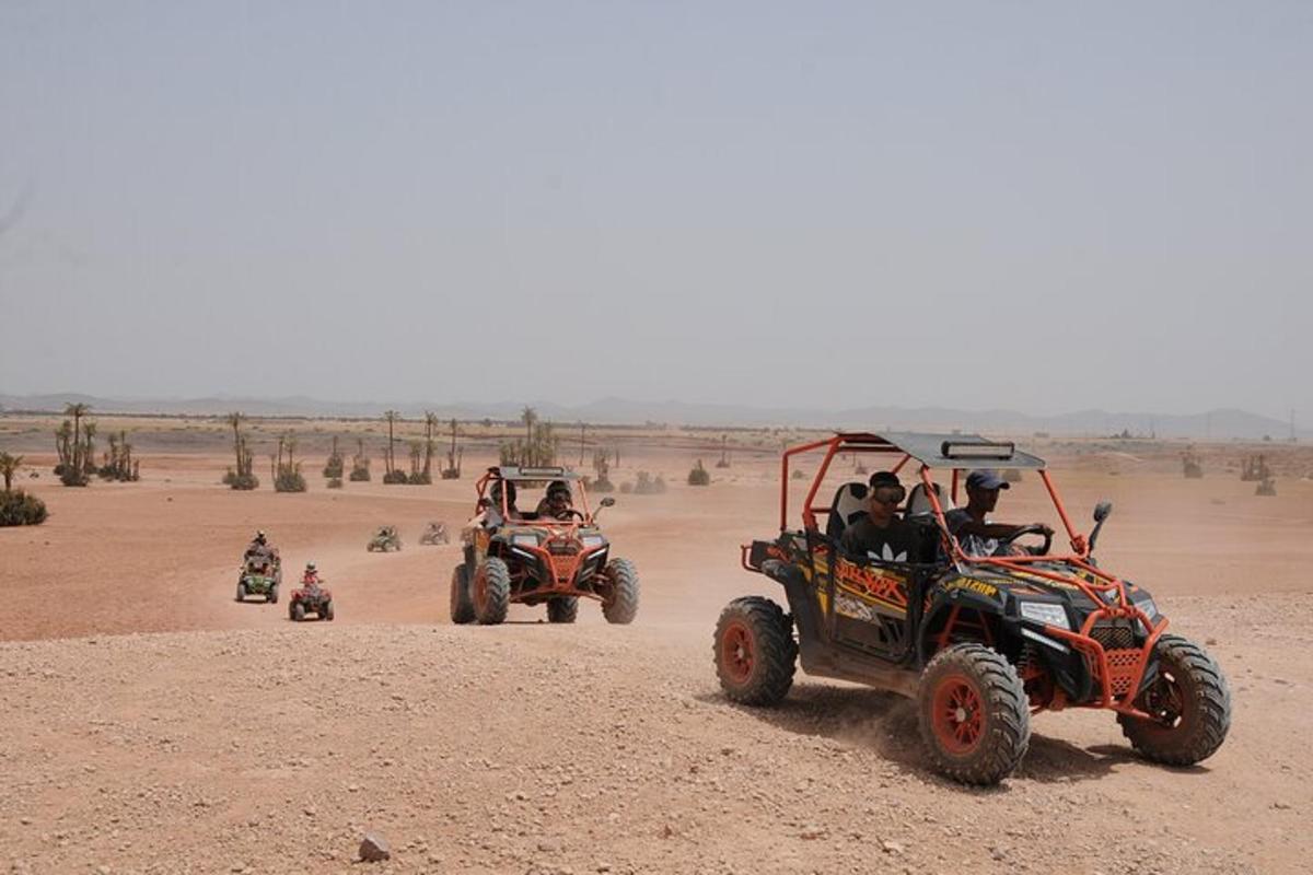 a group of people riding atvs in the desert