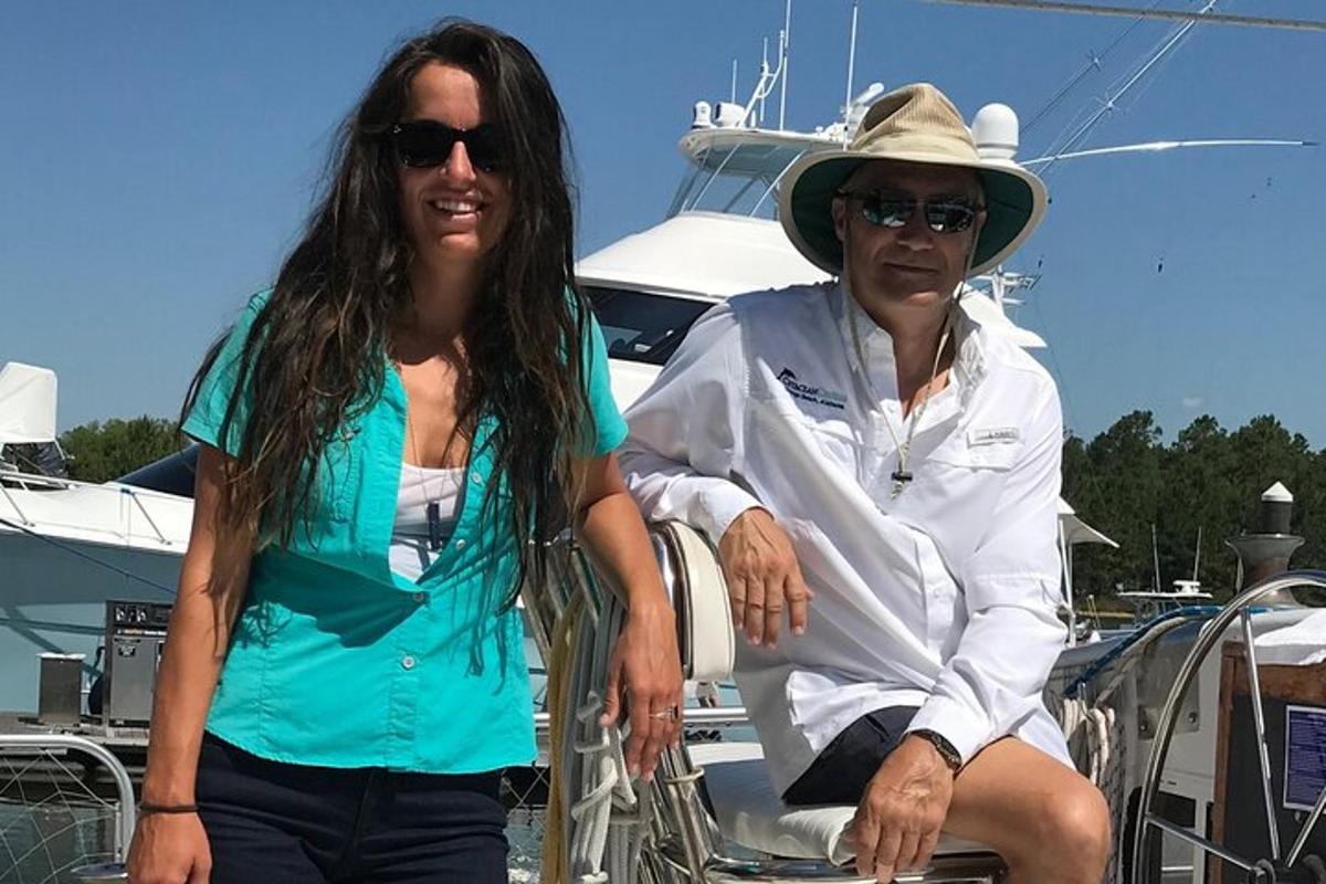 a man and a woman sitting on a boat