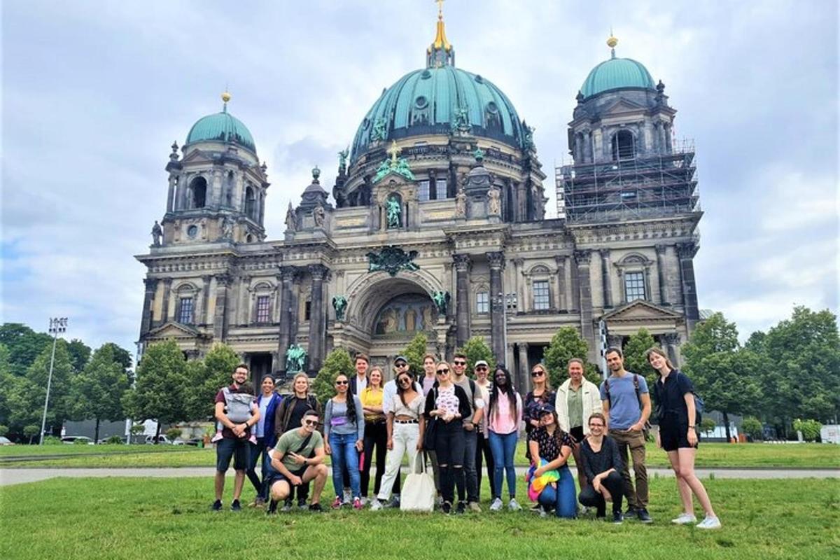 a group of people posing in front of a building