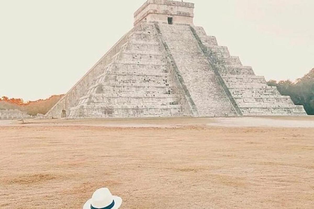 a hat sitting in front of a pyramid