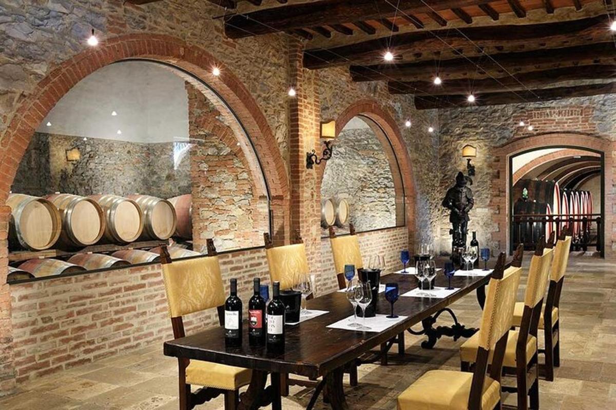 a dining room with a table and chairs and wine barrels
