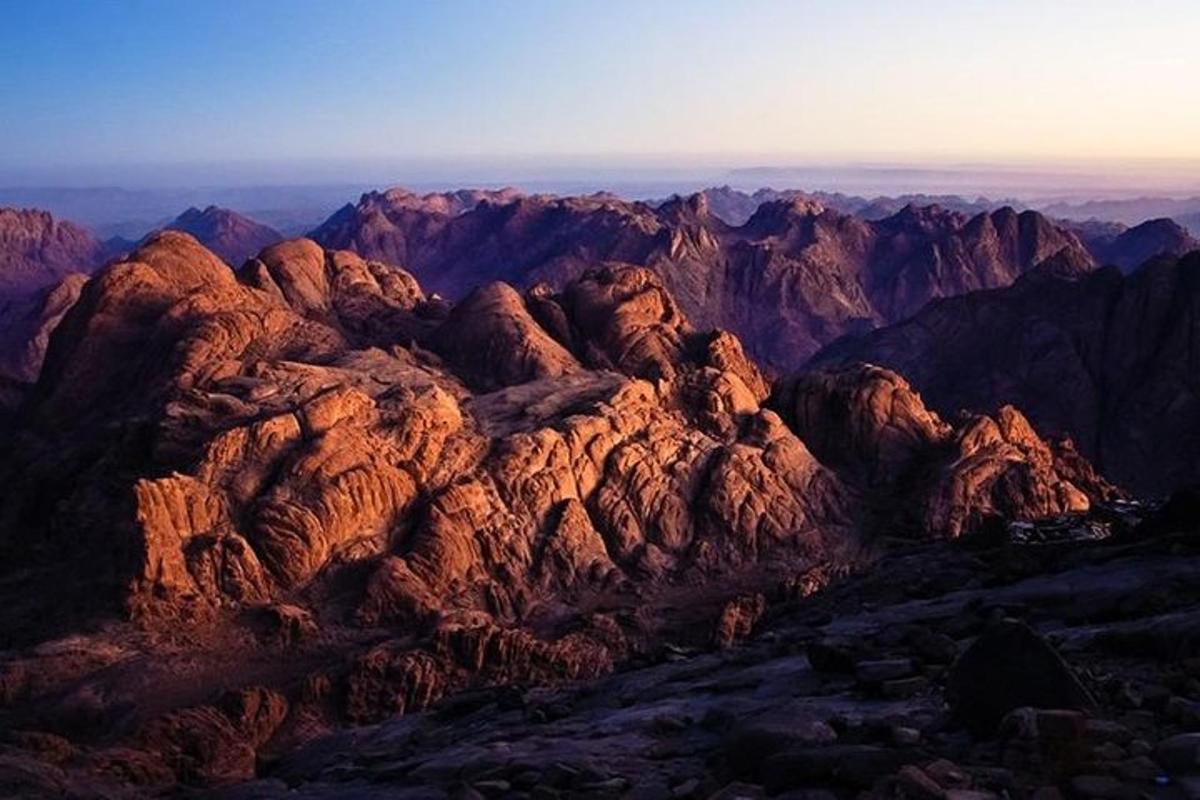 a view of a mountain range at sunset