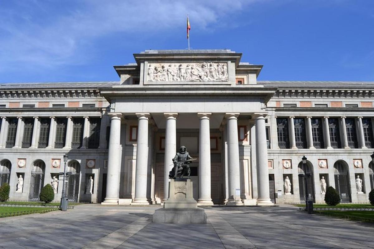 a large building with a statue in front of it