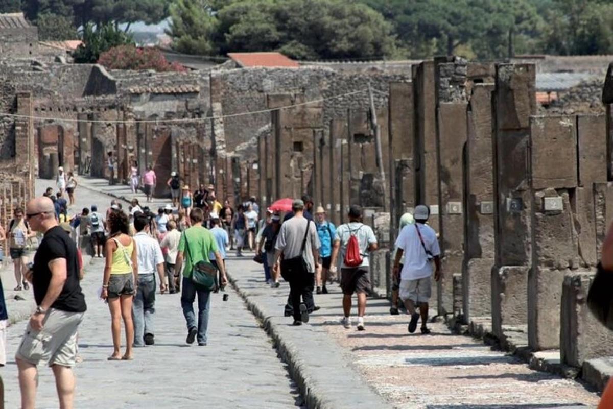 a group of people walking down a street