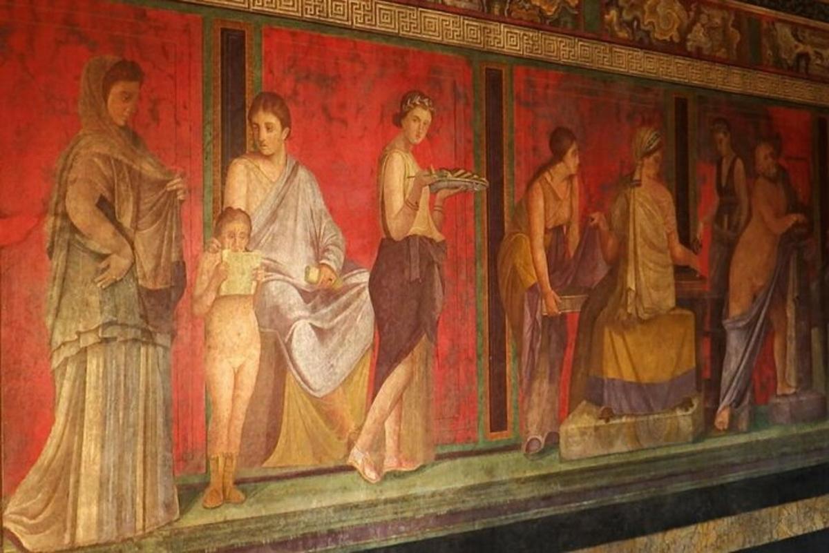 un dipinto di un gruppo di persone su un muro