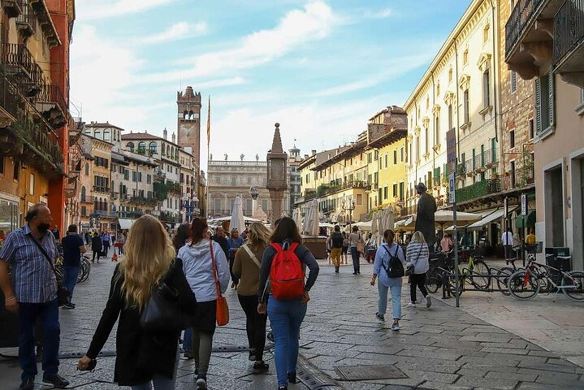 a group of people walking down a city street