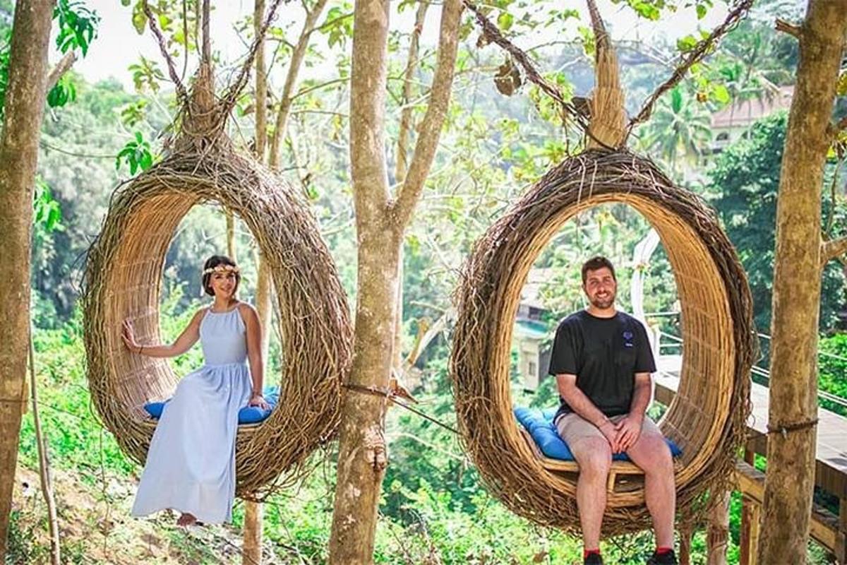 a man and a woman sitting in wicker baskets