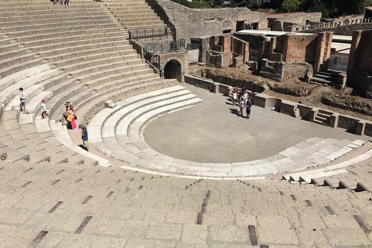 a group of people standing in an amphitheater