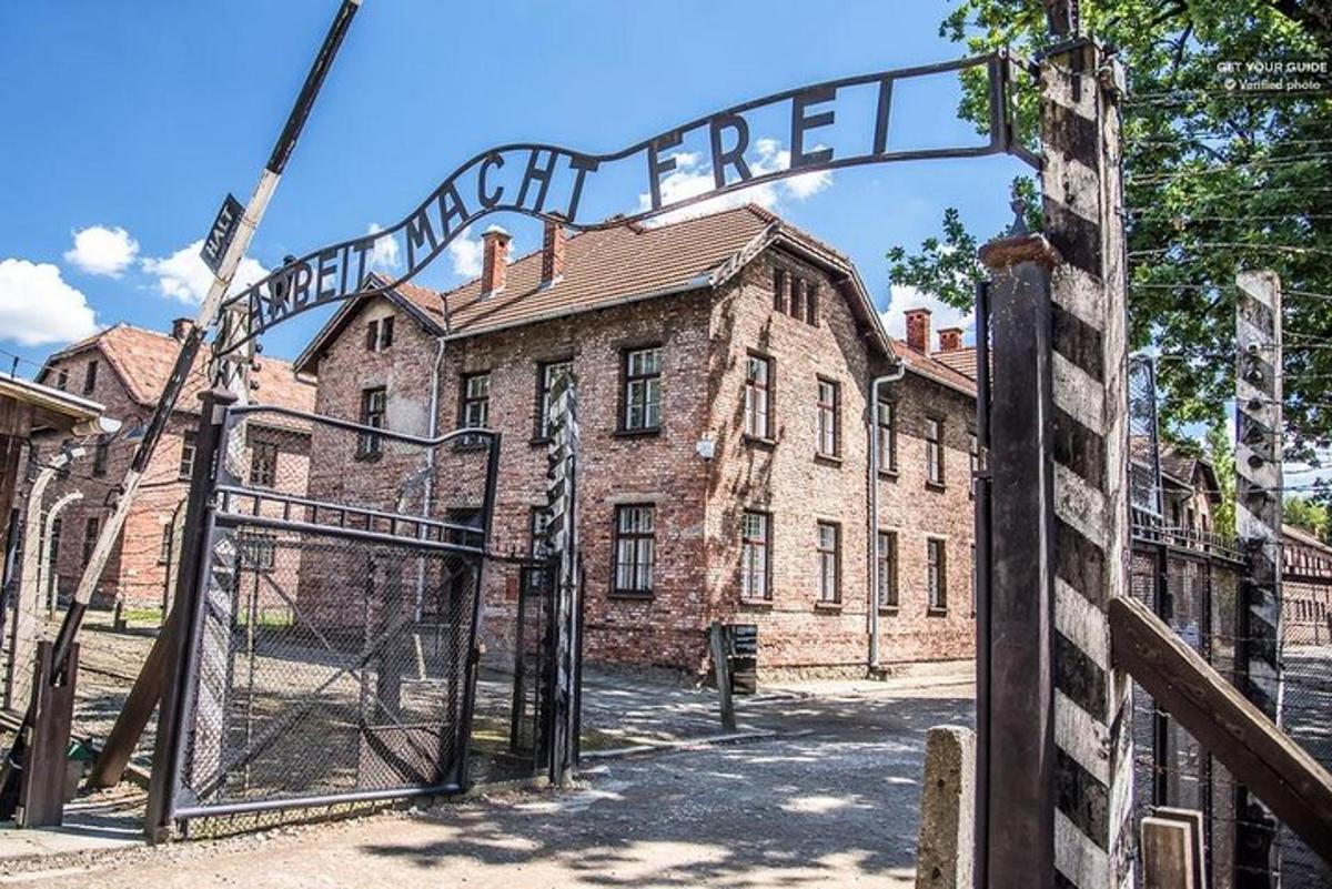 an open gate to an old brick building