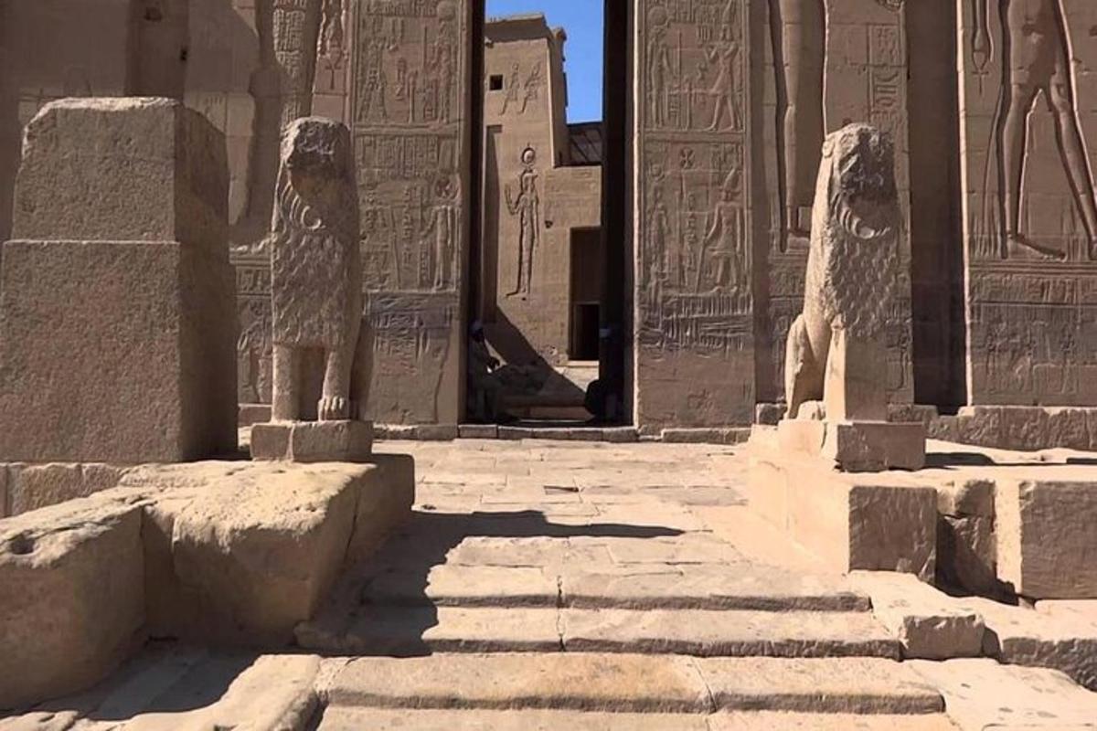 a building with two statues in front