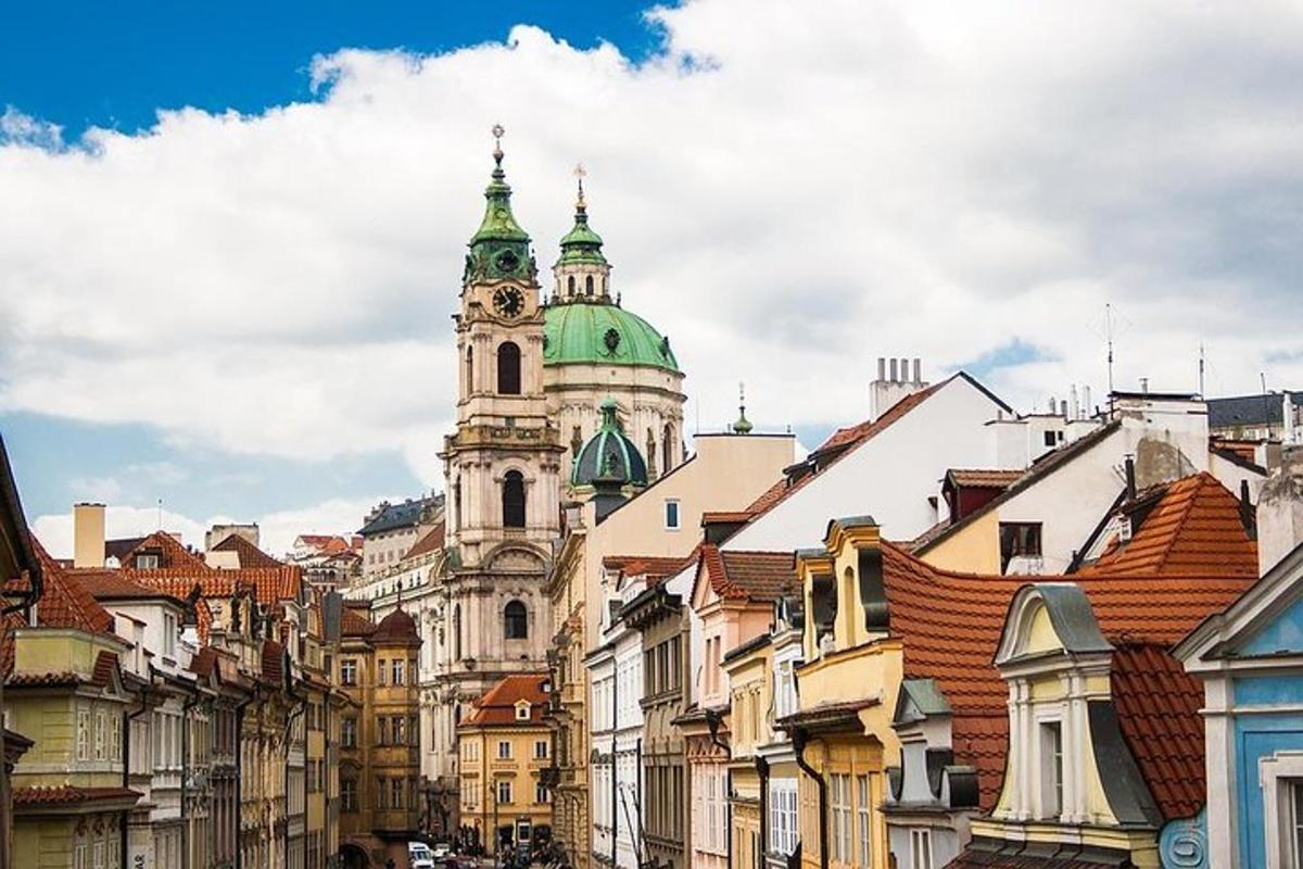 a building with a clock tower in the middle of a city