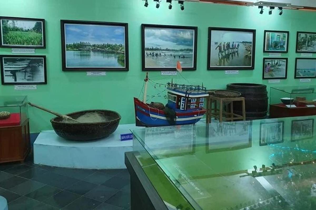 a museum with a boat in a display case