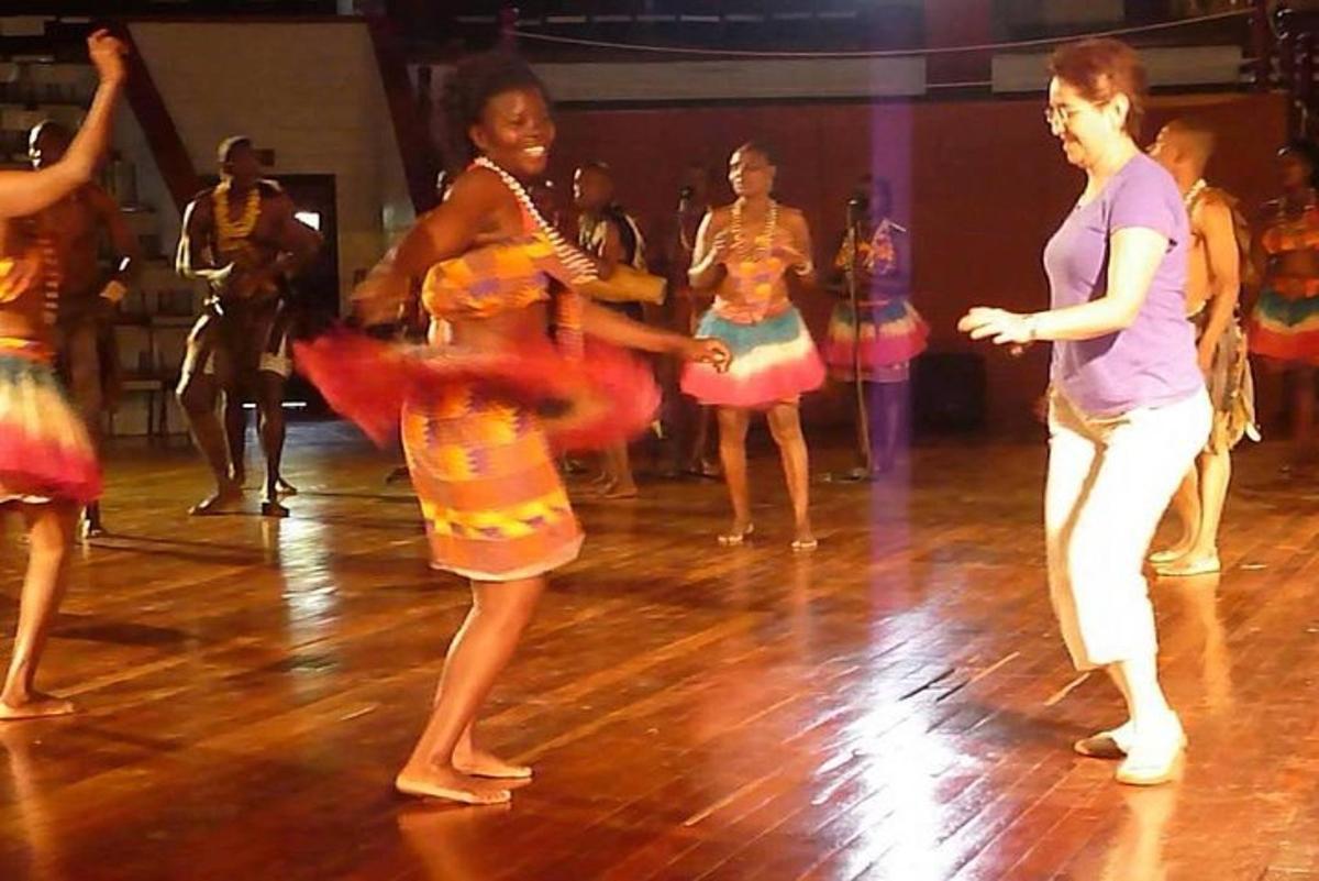 a group of people dancing on a dance floor