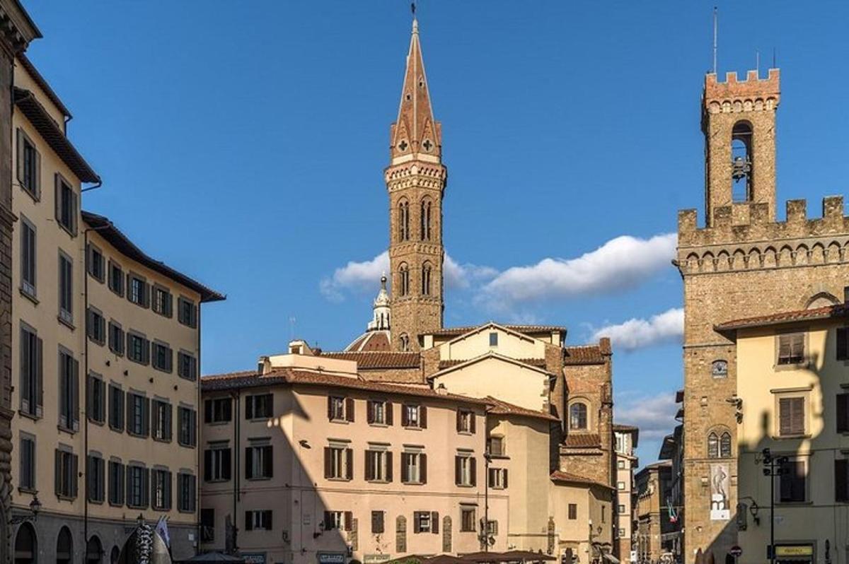 a church with a tall steeple and a tower