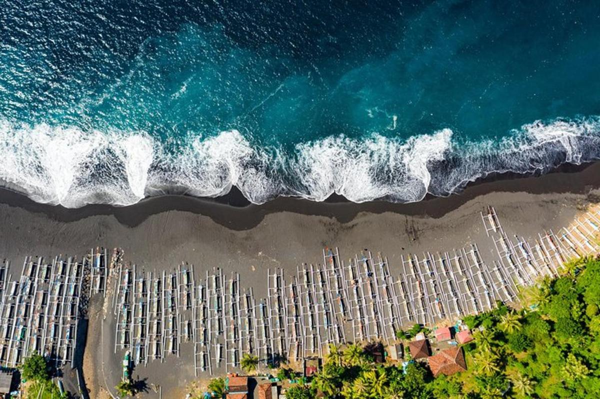 an overhead view of a beach with the ocean