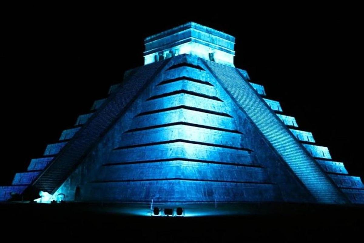 a building lit up in blue at night