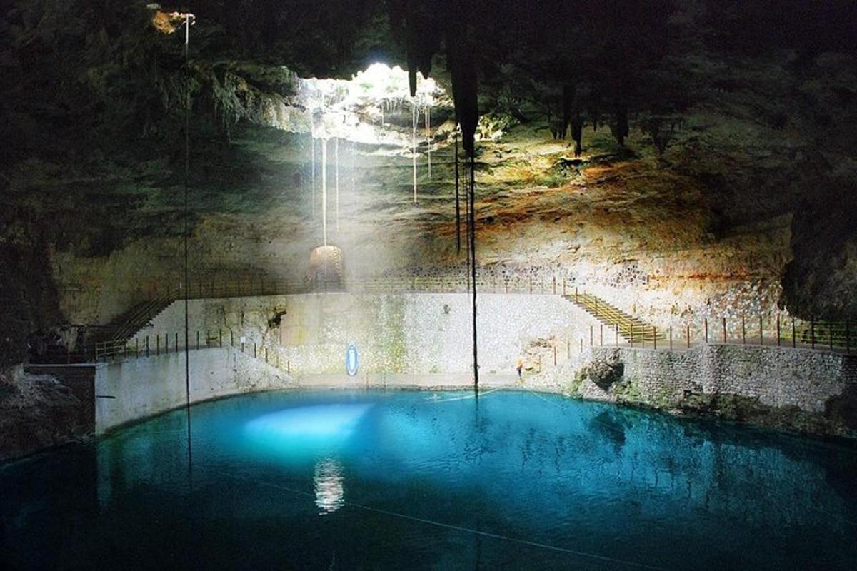 a swimming pool with a light in a cave