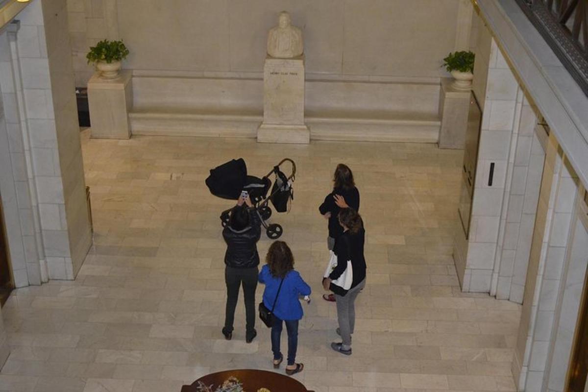 a group of people standing in a hallway in a museum