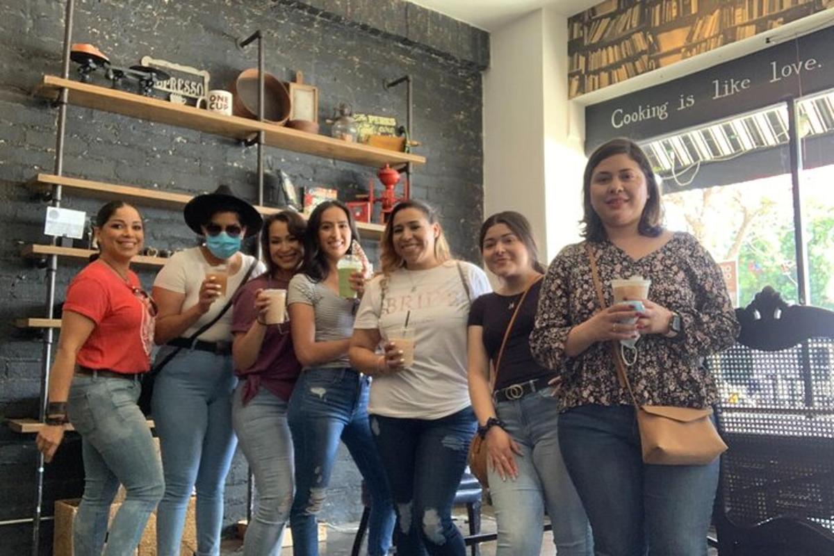 a group of women standing in front of a store