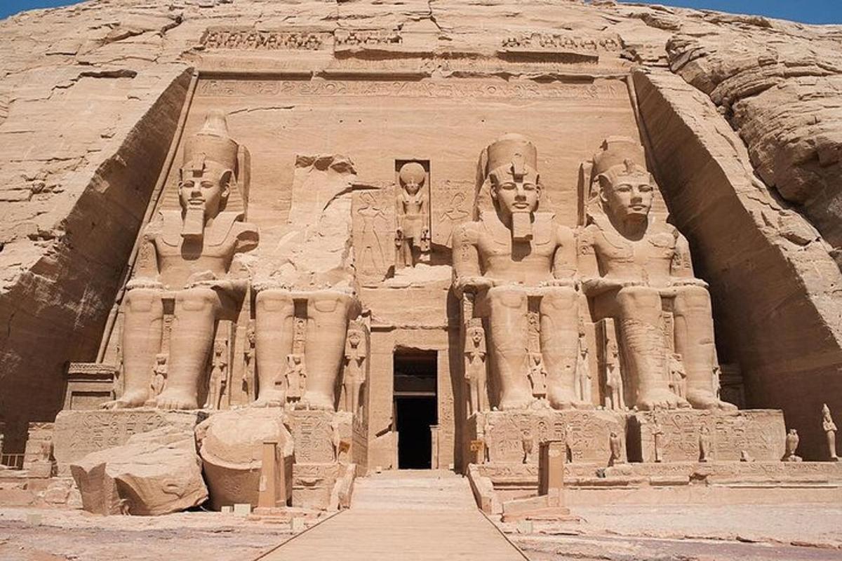 a large building with statues on the side of it