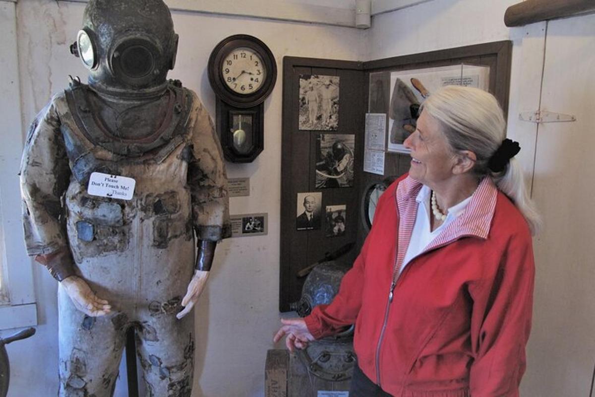 a woman standing next to a robot in a room