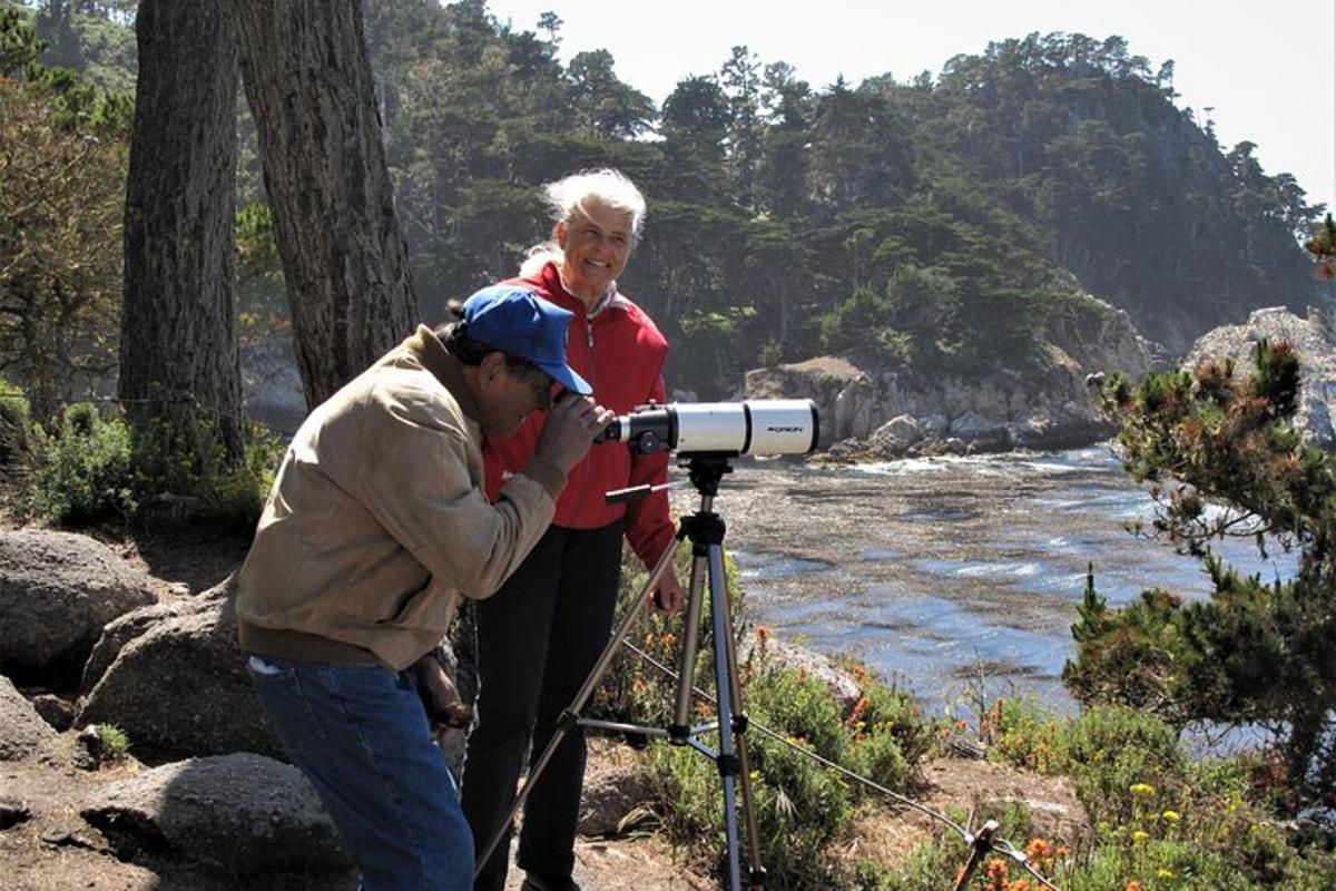 a man taking a picture of a woman in front of a camera