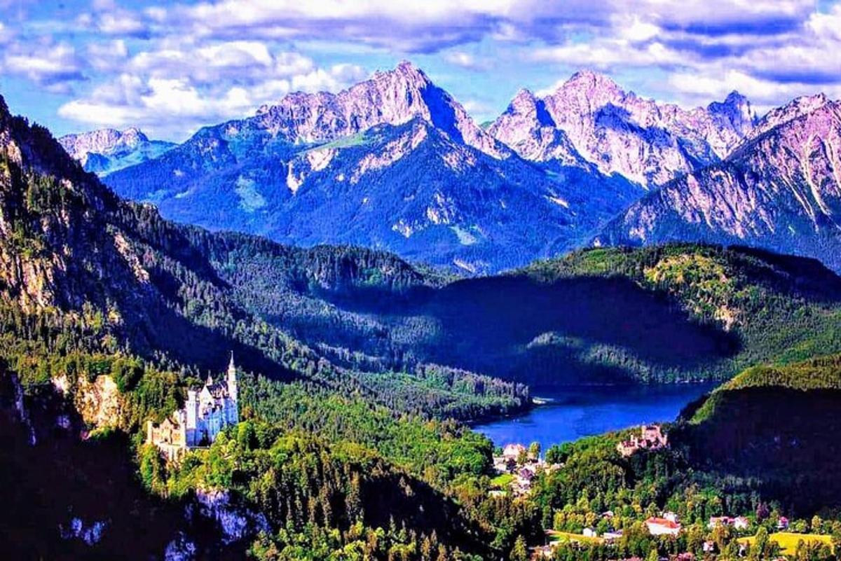 a view of a mountain valley with a lake