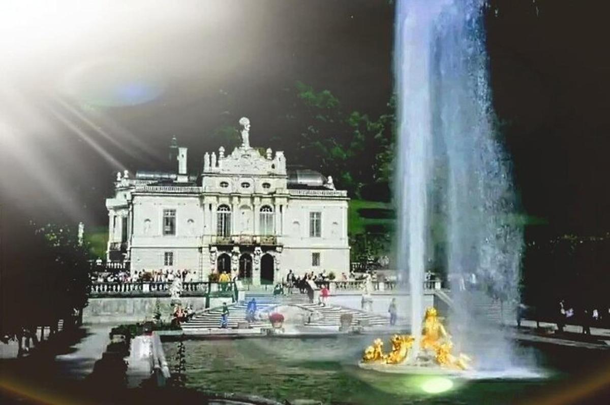 a fountain in front of a white building