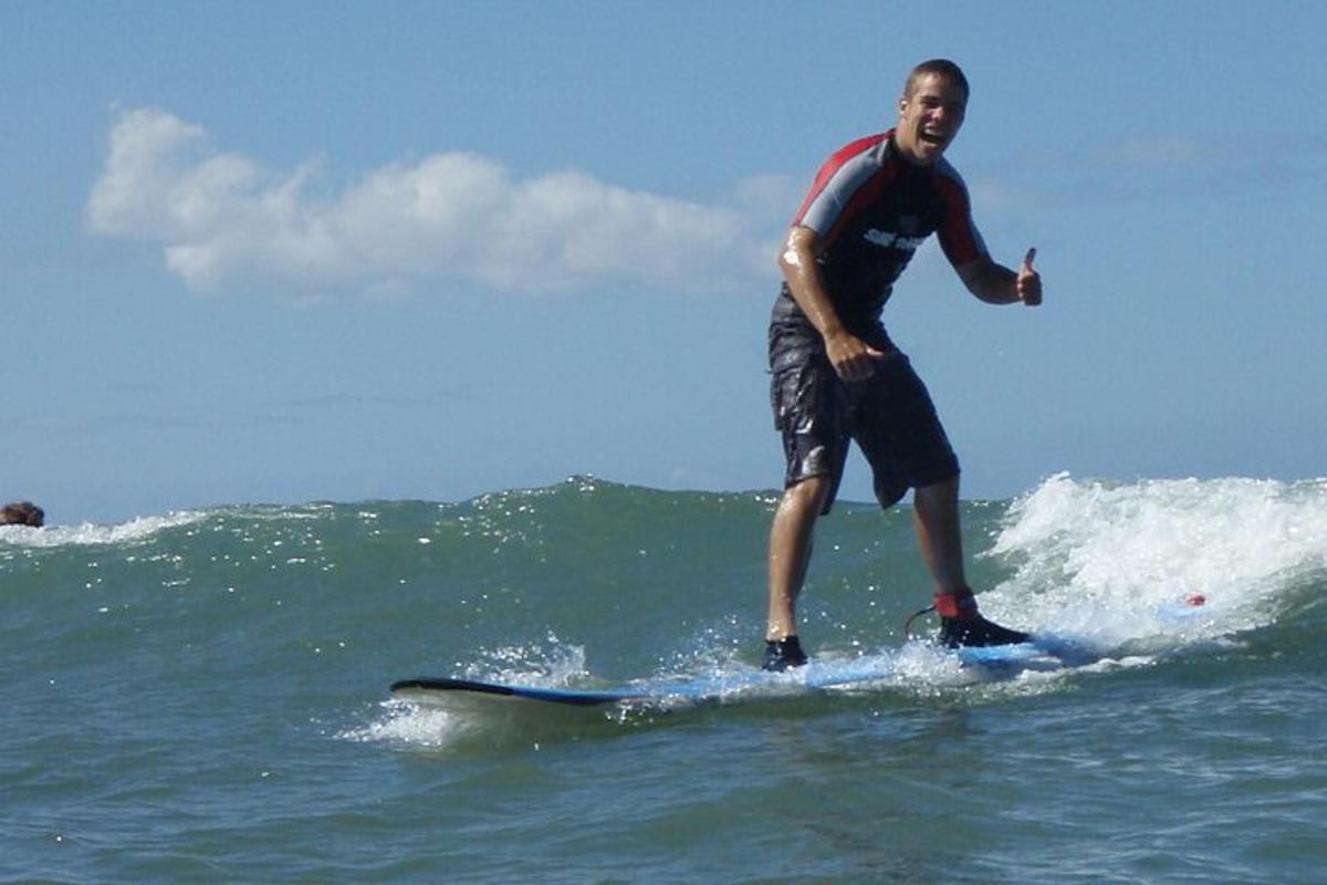 a man riding a wave on a surfboard in the ocean