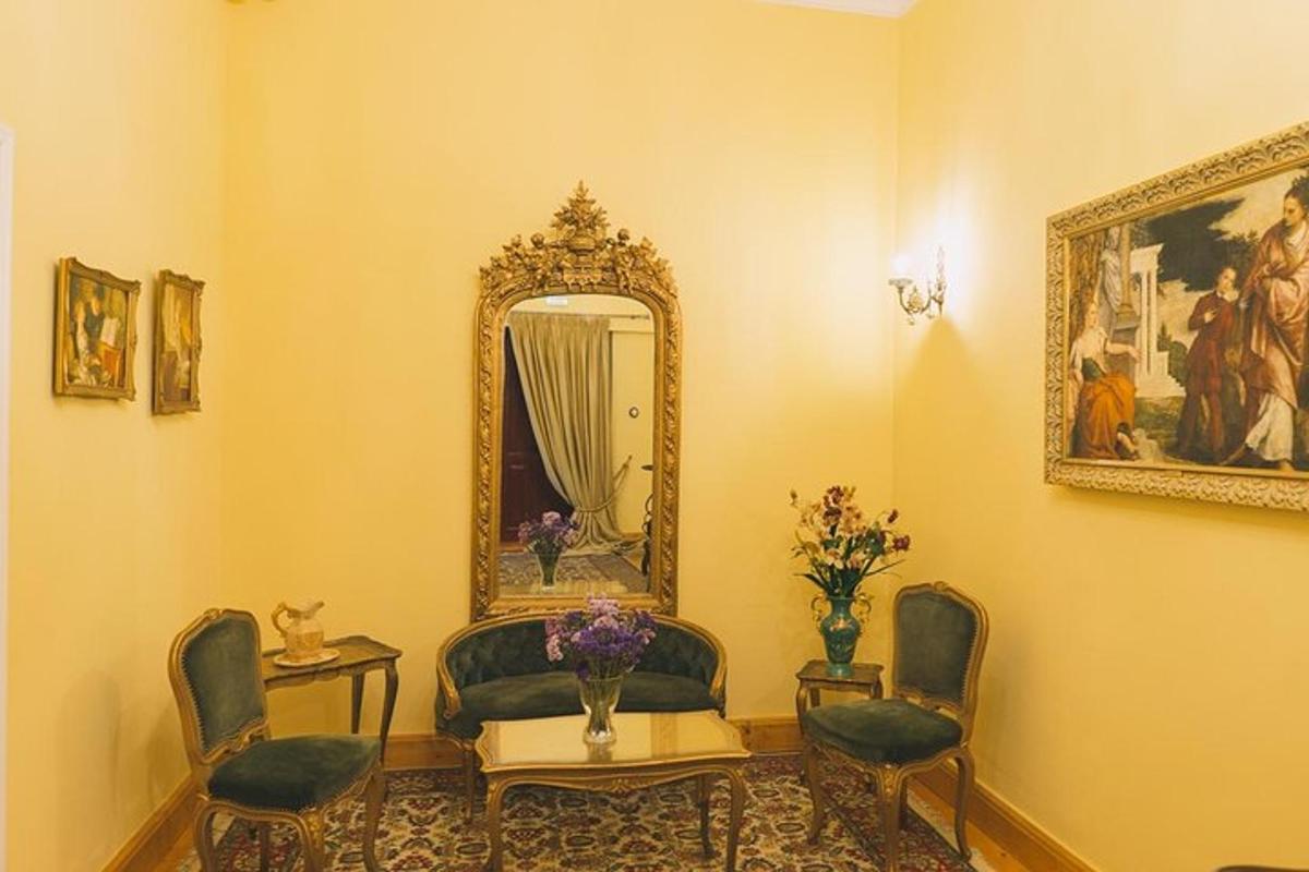 a room with chairs and a mirror and a table