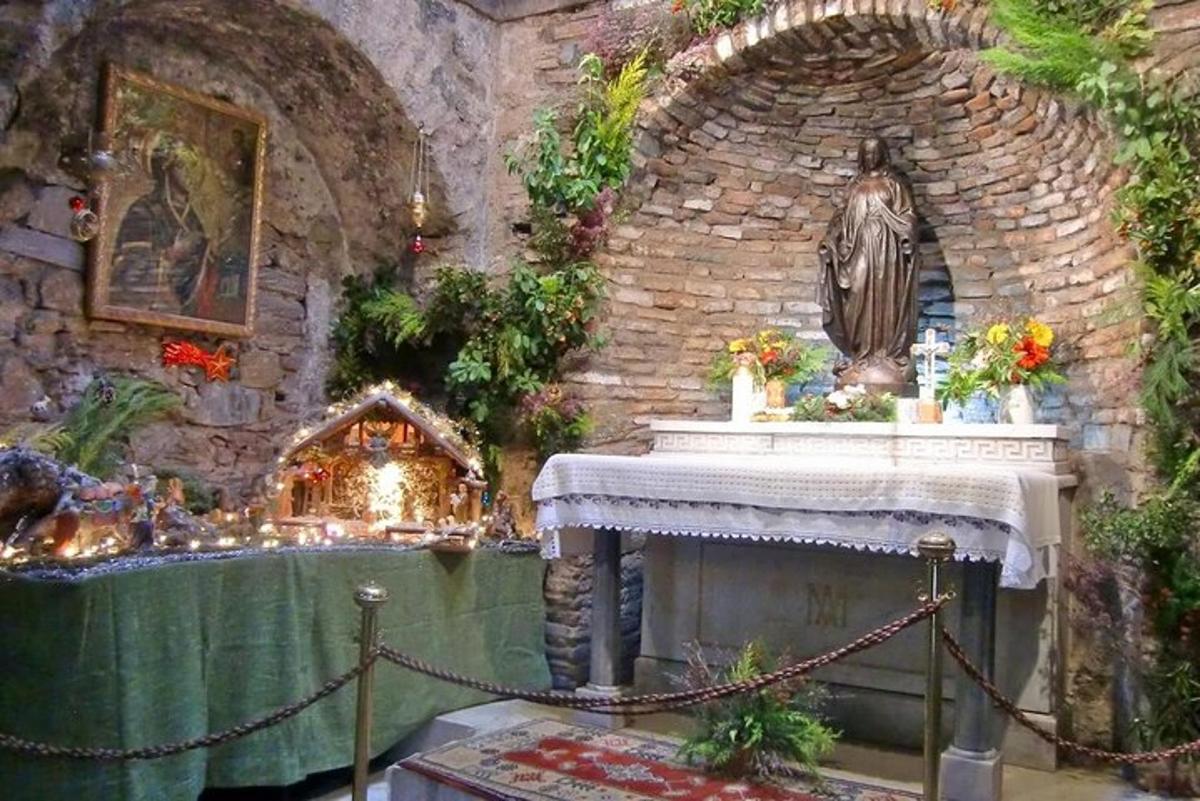 a room with a fireplace and a stone wall