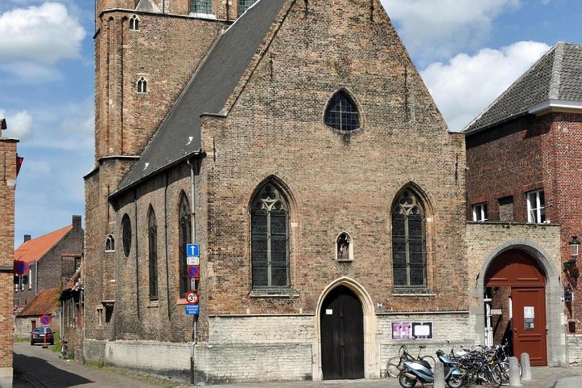 a large brick church with a tall tower