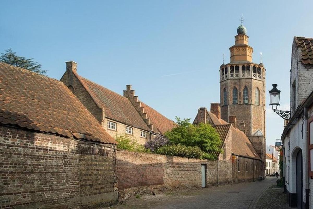 an alley in an old town with a clock tower