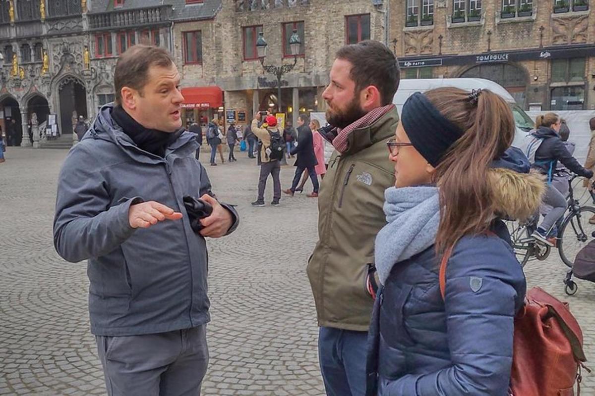 a group of three people standing on a street