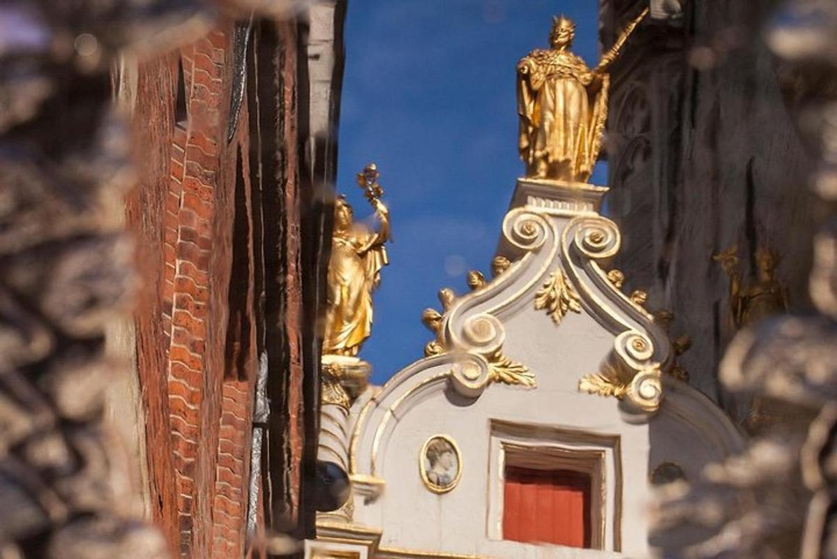 a gold statue on top of a building