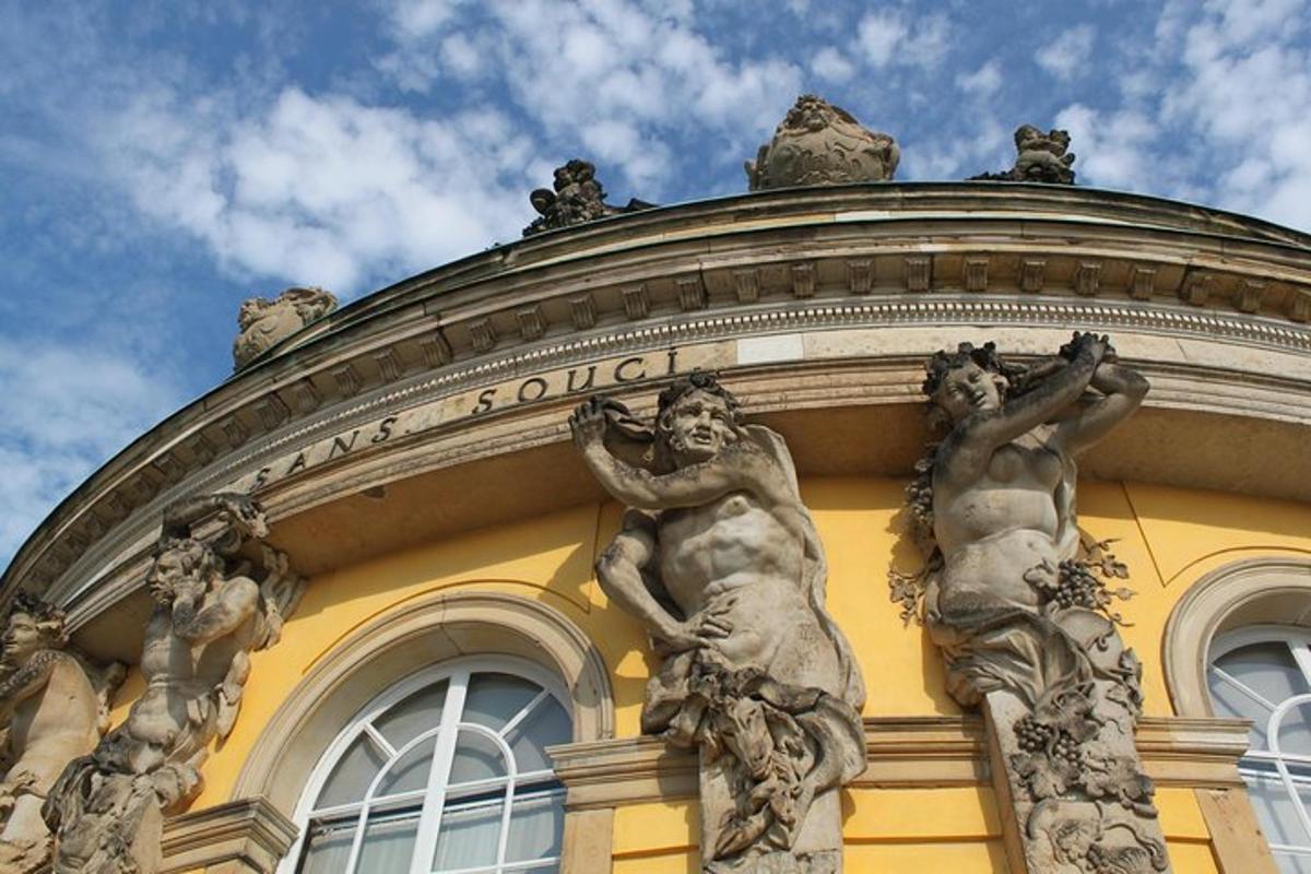 a building with two statues on the side of it