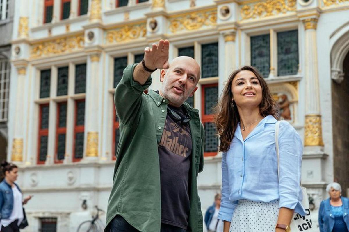 a man and a woman standing in front of a building