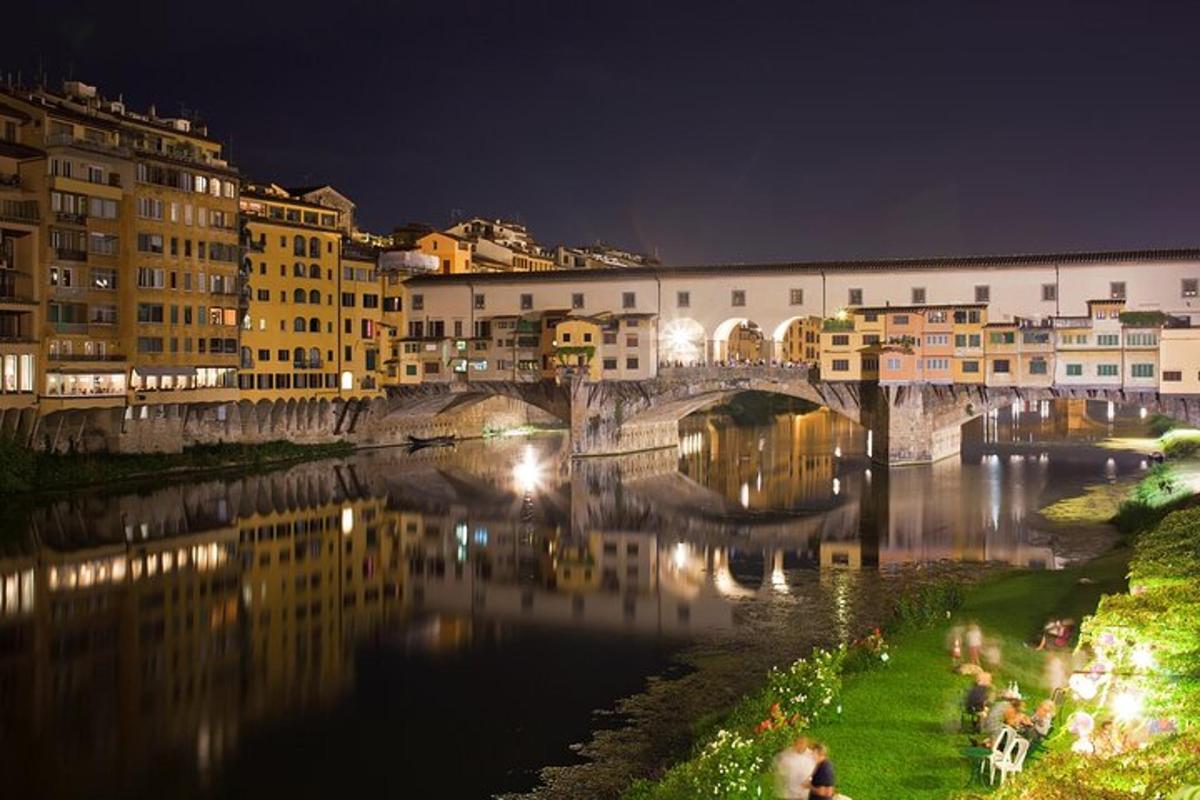 a bridge over a river in a city at night