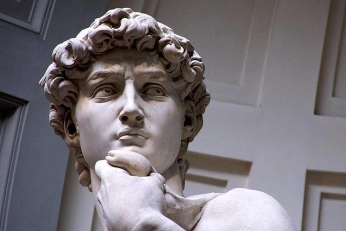 a statue of a woman with her hand on her face