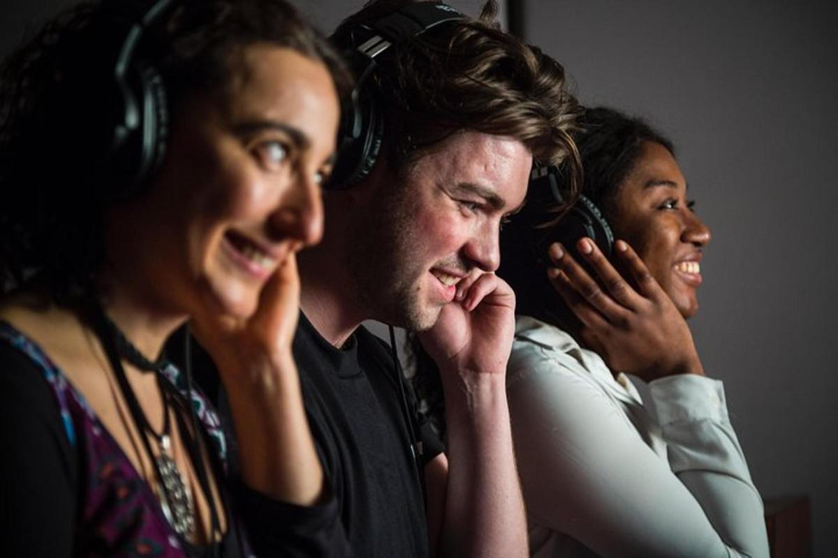 a group of people listening to music with headphones