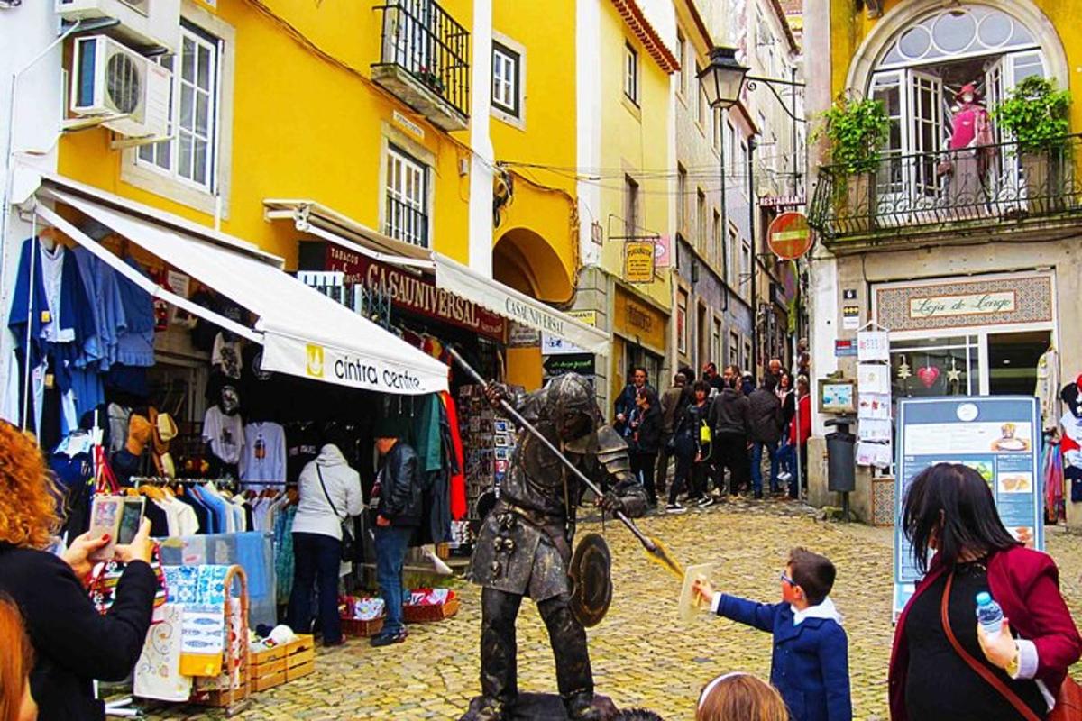 a man in a costume standing on a street