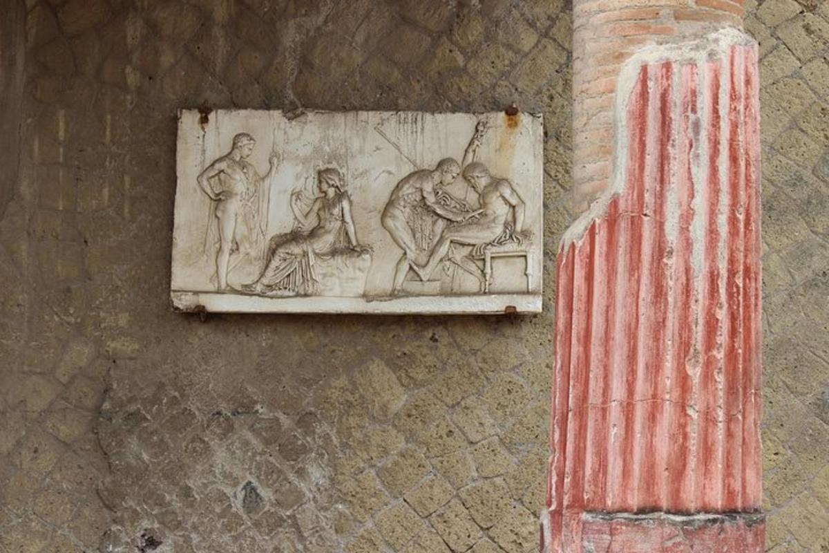 a stone relief on the side of a building