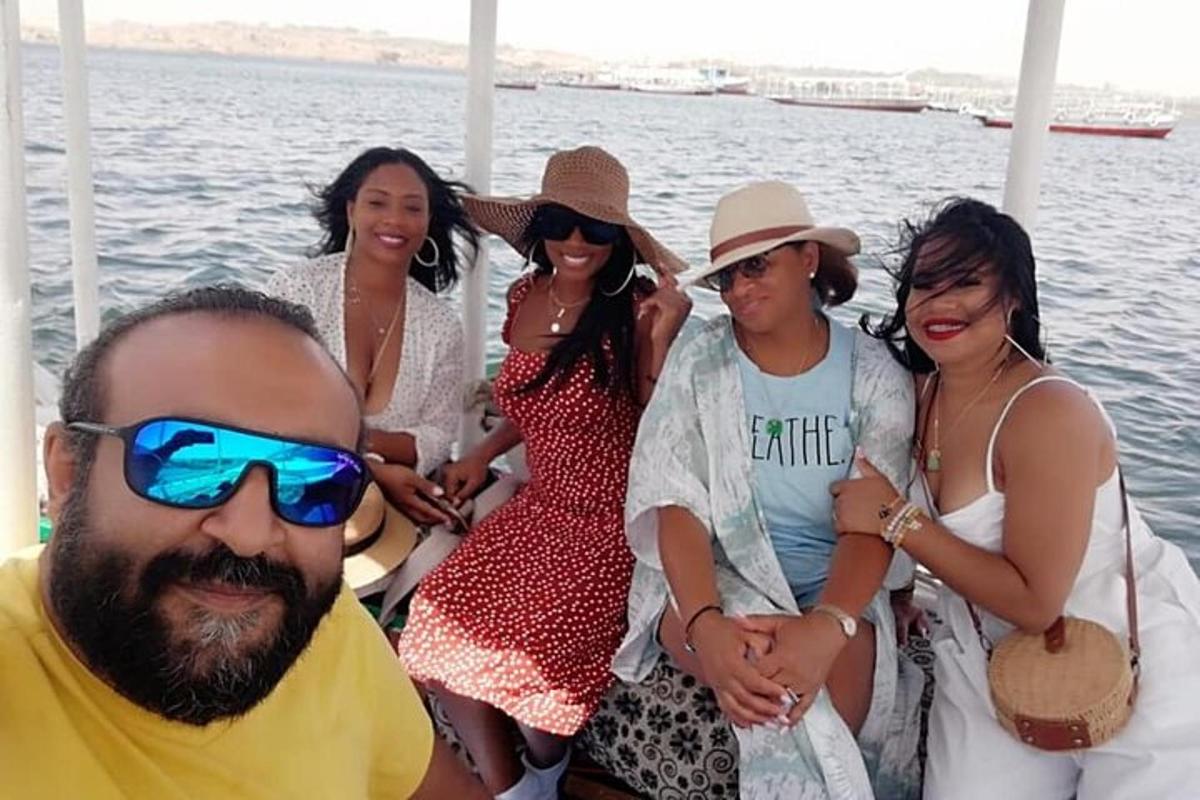 a group of women on a boat in the water